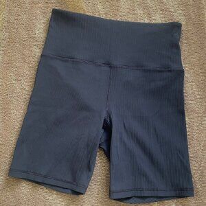 Athleta: Elation Rib Short 7". Greyish/blue color. Small pocket in backband. M.